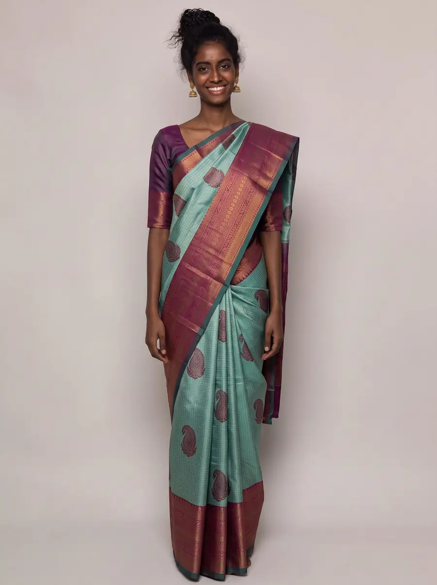 Front view, teal silk saree with maroon zari border